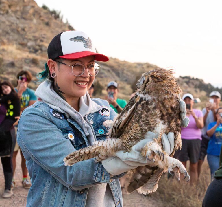 Woman holds owl