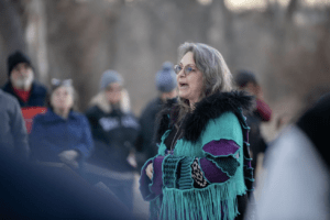 woman speaking at solstice acknoledgement