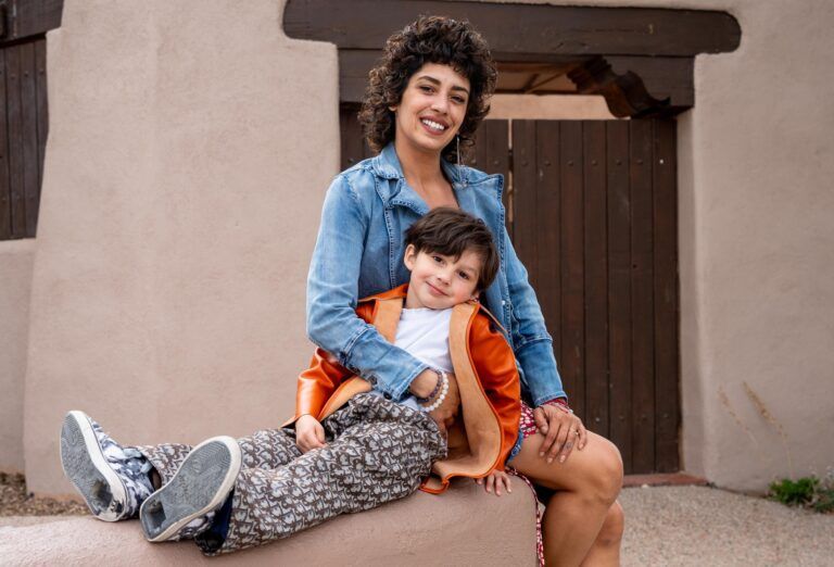 mother and child sitting on bench